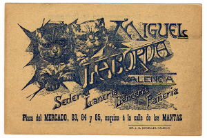 Ein altes Geschäftsblatt mit einem Foto von zwei Katzen, auf dem Text steht, der die Katzen beschreibt.