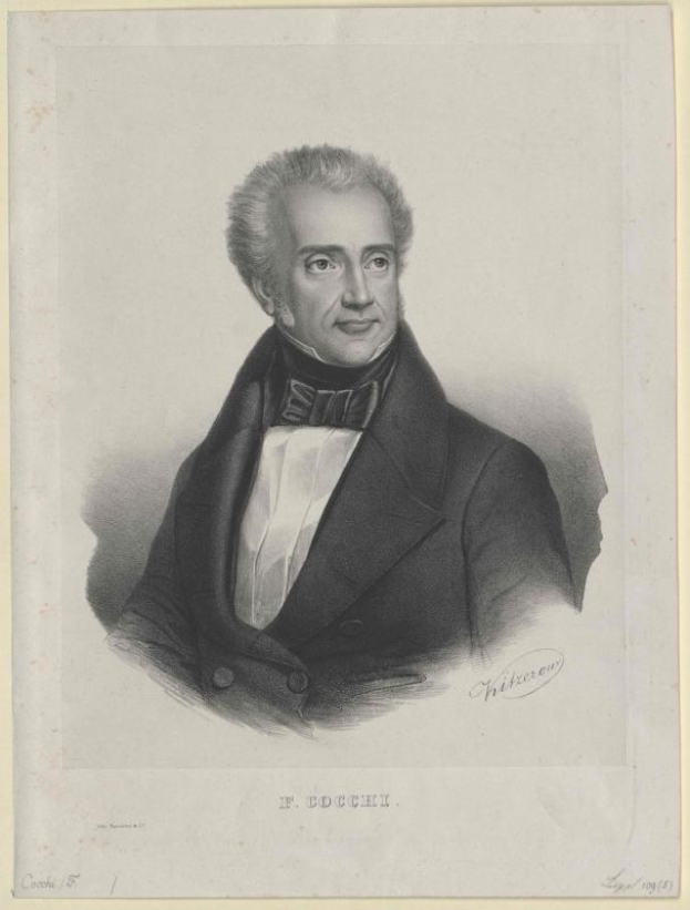 Schwarz-weiß-Porträt des Komponisten F. Cocchi in einem Smoking mit ernster Miene, mit der Aufschrift "Die Musik der Oper" unten.