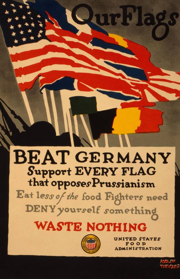 Ein Plakat mit einer roten, weißen und blauen Flagge mit einem weißen Stern, begleitet von fettgedrucktem schwarzem Text, der "Unsere Flaggen schlagen Deutschland - Unterstützt jede Flagge, die gegen Preußentum kämpft", umgeben von einem weißen Rand.
