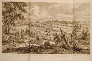 Offenes Buch mit der Aufschrift 'Ansicht der Schlacht von Castellum und Castellium aus dem Illustrated London News', das eine Landschaft mit einer Gruppe von Menschen im Vordergrund, Bäumen, Pflanzen, Gebäuden im Hintergrund und Wolken am Himmel zeigt.