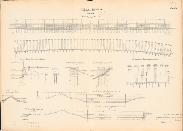 Ein aufgeschlagenes Buch mit einer detaillierten Zeichnung einer Bahnschiene und eines Eisenbahnsystems, begleitet von Text und Illustrationen.